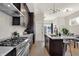 Modern kitchen with dark cabinets, stainless steel appliances, and island at 417 E Morris St, Indianapolis, IN 46225