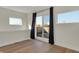 Bright bedroom with hardwood floors and access to a private balcony at 417 E Morris St, Indianapolis, IN 46225