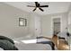 Bedroom with queen bed, ceiling fan, and walk-in closet at 417 E Morris St, Indianapolis, IN 46225