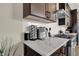 Modern kitchen countertop with herringbone backsplash and appliances at 417 E Morris St, Indianapolis, IN 46225