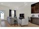 Living Room with gray sofa, tv and adjacent kitchen at 417 E Morris St, Indianapolis, IN 46225