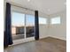 Bedroom with hardwood floors and sliding glass doors to a rooftop deck at 417 E Morris St, Indianapolis, IN 46225