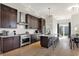 Modern kitchen with dark cabinetry, marble countertops, and island at 417 E Morris St, Indianapolis, IN 46225