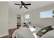 Bright bedroom with a queen bed, walk-in closet, and window at 417 E Morris St, Indianapolis, IN 46225