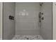 Spa-like shower with vertical tile and hexagon floor at 417 E Morris St, Indianapolis, IN 46225