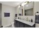 Modern bathroom with double vanity and a walk-in shower at 417 E Morris St, Indianapolis, IN 46225