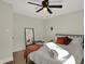 Bedroom with full bed, ceiling fan, and hardwood floors at 417 E Morris St, Indianapolis, IN 46225