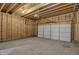 Unfinished garage interior with overhead door at 417 E Morris St, Indianapolis, IN 46225
