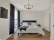 Spacious bedroom with a comfortable bed and large windows at 417 E Morris St, Indianapolis, IN 46225