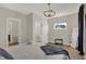 Bright bedroom with a queen bed and access to stairs at 417 E Morris St, Indianapolis, IN 46225