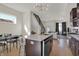 Open concept kitchen features island, stainless steel appliances, and dark cabinetry at 417 E Morris St, Indianapolis, IN 46225