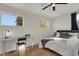 Spacious bedroom with queen bed, desk, and two windows at 417 E Morris St, Indianapolis, IN 46225