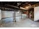 Unfinished basement offering ample storage space at 385 S Arlington Ave, Indianapolis, IN 46219