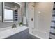Clean bathroom with subway tile shower and gray vanity at 385 S Arlington Ave, Indianapolis, IN 46219