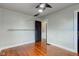 Bedroom with hardwood floors, a closet, and floating shelves at 385 S Arlington Ave, Indianapolis, IN 46219