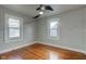 Bedroom with hardwood floors and two windows at 385 S Arlington Ave, Indianapolis, IN 46219