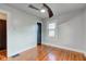 Bedroom with hardwood floors, ceiling fan, and closet at 385 S Arlington Ave, Indianapolis, IN 46219