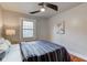 Spacious bedroom with hardwood floors and ceiling fan at 385 S Arlington Ave, Indianapolis, IN 46219