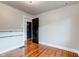 Bedroom with hardwood floors, floating shelves and a closet at 385 S Arlington Ave, Indianapolis, IN 46219