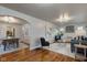 Open concept dining room with hardwood floors and farmhouse table at 385 S Arlington Ave, Indianapolis, IN 46219