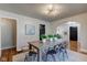 Dining room with hardwood floors and access to bedroom at 385 S Arlington Ave, Indianapolis, IN 46219