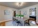 Dining room with a rustic wood table and metal chairs at 385 S Arlington Ave, Indianapolis, IN 46219