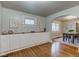 Dining area with built-in storage and hardwood floors at 385 S Arlington Ave, Indianapolis, IN 46219