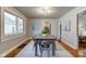 Dining room with a large wood table and metal chairs at 385 S Arlington Ave, Indianapolis, IN 46219