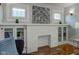 White brick fireplace with built-in shelving at 385 S Arlington Ave, Indianapolis, IN 46219