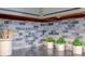 Gray cabinets and marble tile backsplash in this updated kitchen at 385 S Arlington Ave, Indianapolis, IN 46219