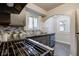 Modern gas range and updated sink in this renovated kitchen at 385 S Arlington Ave, Indianapolis, IN 46219