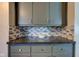 Gray kitchen cabinets and a contrasting countertop create a stylish space at 385 S Arlington Ave, Indianapolis, IN 46219