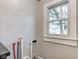 Functional laundry room with plumbing hookups and a window at 385 S Arlington Ave, Indianapolis, IN 46219