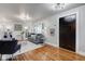 Living room with hardwood floors, gray walls, and green sofa at 385 S Arlington Ave, Indianapolis, IN 46219