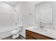 Bathroom with shower/tub combo, wood vanity, and flooring at 2081 Covey Dr, Danville, IN 46122
