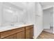 Double vanity bathroom with wood cabinets and access to a walk-in closet at 2081 Covey Dr, Danville, IN 46122