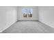 Spacious bedroom featuring grey carpet and a large window at 2081 Covey Dr, Danville, IN 46122