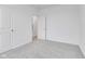 Bright bedroom with grey carpet and access to another room at 2081 Covey Dr, Danville, IN 46122