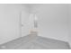 Spacious bedroom with grey carpet and access to another room at 2081 Covey Dr, Danville, IN 46122