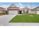 Modern two-story home with a neutral color palette and a neatly landscaped yard at 2081 Covey Dr, Danville, IN 46122