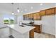Modern kitchen with wood cabinets, white countertops, and an island at 2081 Covey Dr, Danville, IN 46122