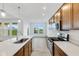 Modern kitchen with stainless steel appliances and white quartz countertops at 2081 Covey Dr, Danville, IN 46122