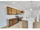 Modern kitchen with stainless steel appliances and an island with white countertops at 2081 Covey Dr, Danville, IN 46122