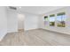 Spacious living room with vinyl flooring and multiple windows providing ample natural light at 2081 Covey Dr, Danville, IN 46122