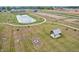 Aerial view of Quail West community showing pond and pavilion at 2081 Covey Dr, Danville, IN 46122