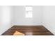 Empty bedroom with hardwood floors and a window at 1215 N Gladstone Ave, Indianapolis, IN 46201