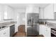 Stainless steel refrigerator and granite countertops in a modern kitchen at 1215 N Gladstone Ave, Indianapolis, IN 46201