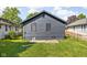 Backyard view showing a dark gray shed and neighboring house at 1215 N Gladstone Ave, Indianapolis, IN 46201
