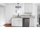 White kitchen cabinets, granite countertops, and stainless steel dishwasher at 1215 N Gladstone Ave, Indianapolis, IN 46201