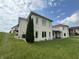 House with white brick exterior, multiple balconies and green lawn at 7647 Monte Carlo Way, Indianapolis, IN 46278